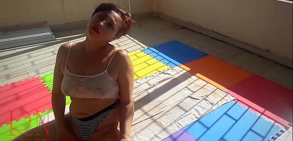  Touch pussy outdoors. Attractive lady is sunbathing on the roof of hotel
